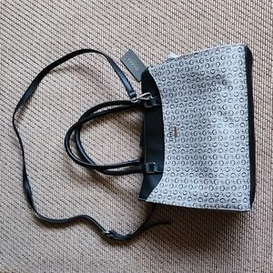 Guess purse black and gray hand bag with a cross body strap for women.